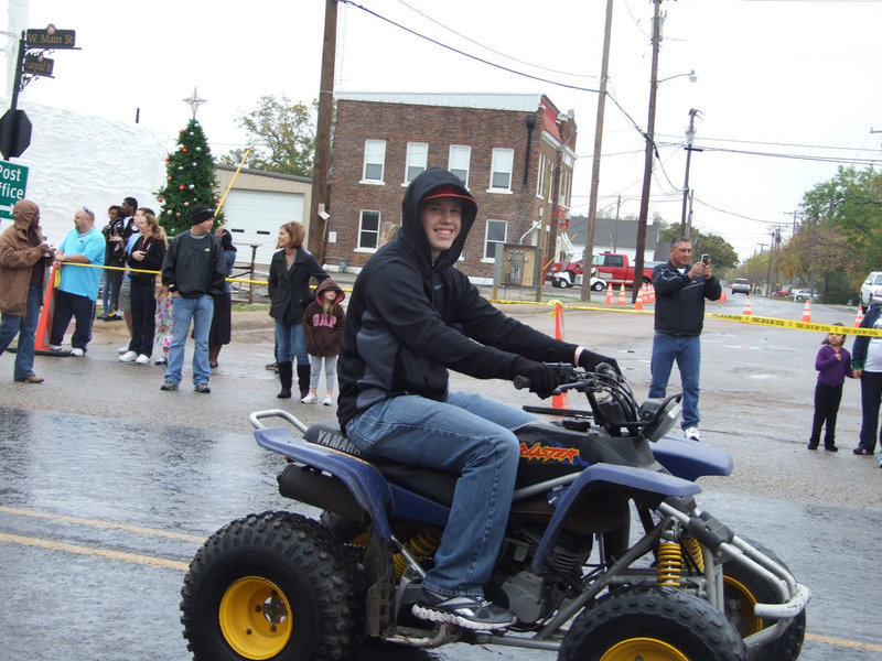 Image: Justin “Buck” Buchanan rides in the parade.