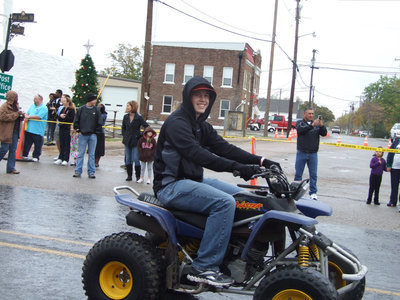 Image: Justin “Buck” Buchanan rides in the parade.