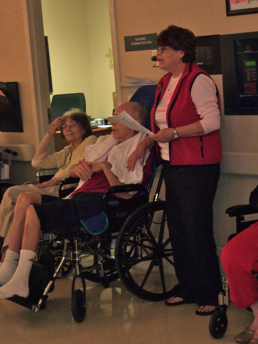 Image: Paula Mandrell (2nd grade teacher) coaching her students as they sing.