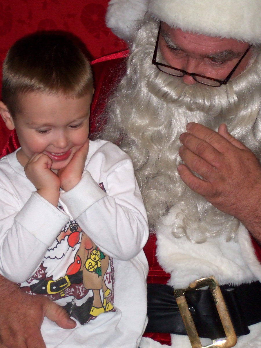 Image: Thrilled to sit in Santa’s lap.