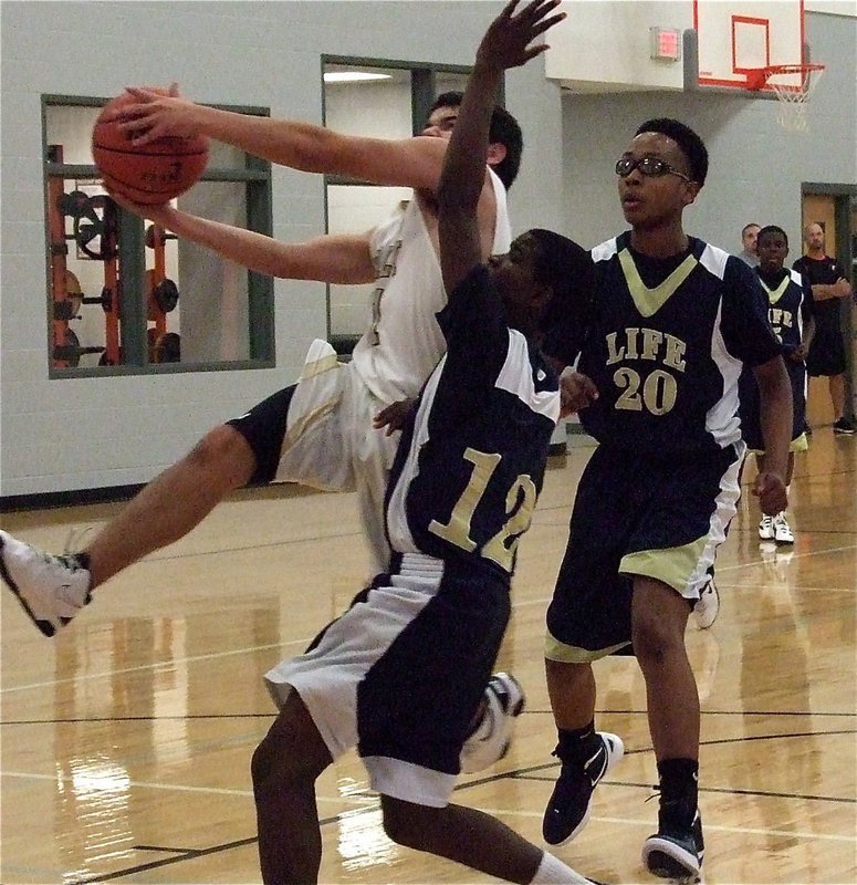 Image: Tyler Anderson(11) finishes the fast break against Red Oak Life Oak Cliff during the Ferris JV Boys Basketball Tournament.