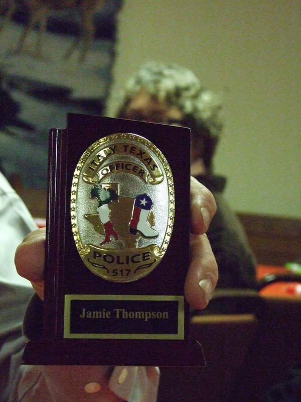 Image: All of the officers received a placque engraved with their police badge.