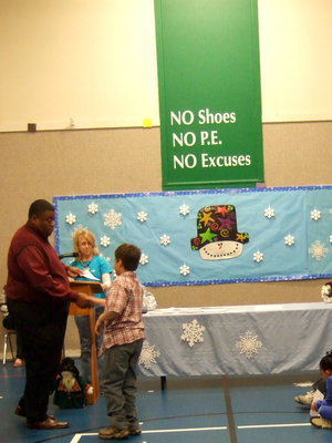 Image: Mike South proudly shakes Mr. Miller’s hand.