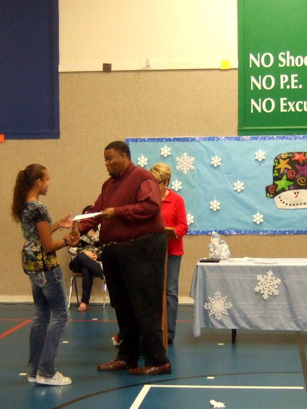 Image: How cute is she, shaking Mr. Miller’s hand and accepting her awards!