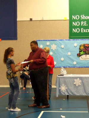 Image: How cute is she, shaking Mr. Miller’s hand and accepting her awards!