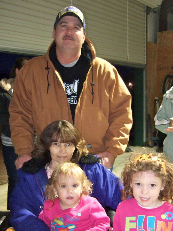 Image: Carl and Dianne Jaynes with their two grandchildren.