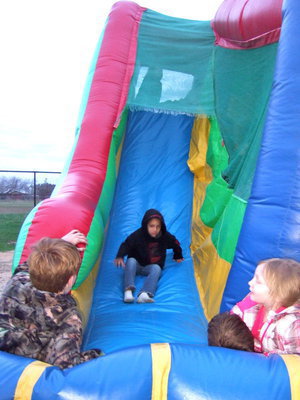 Image: Here he comes down the slide!