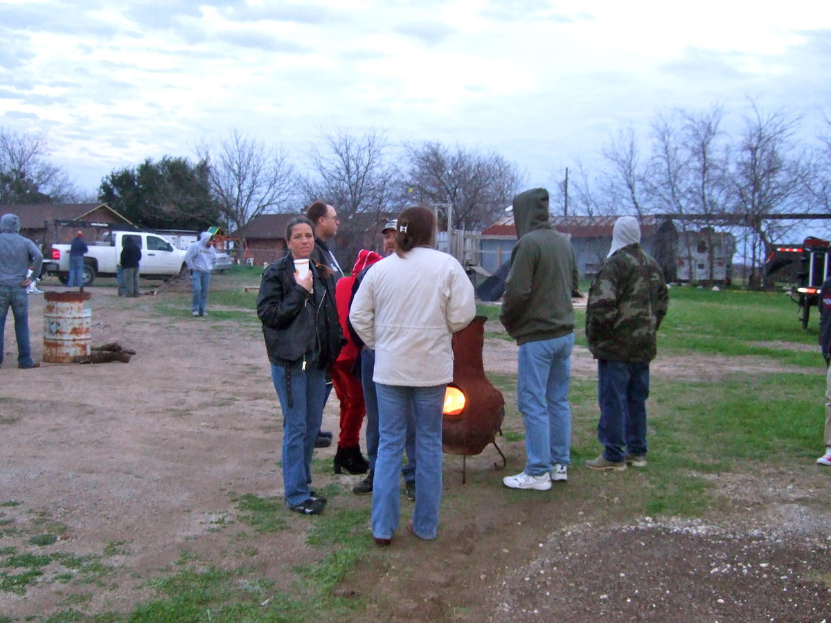 Image: Keeping warm by the fire.