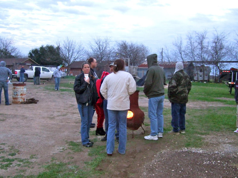 Image: Keeping warm by the fire.