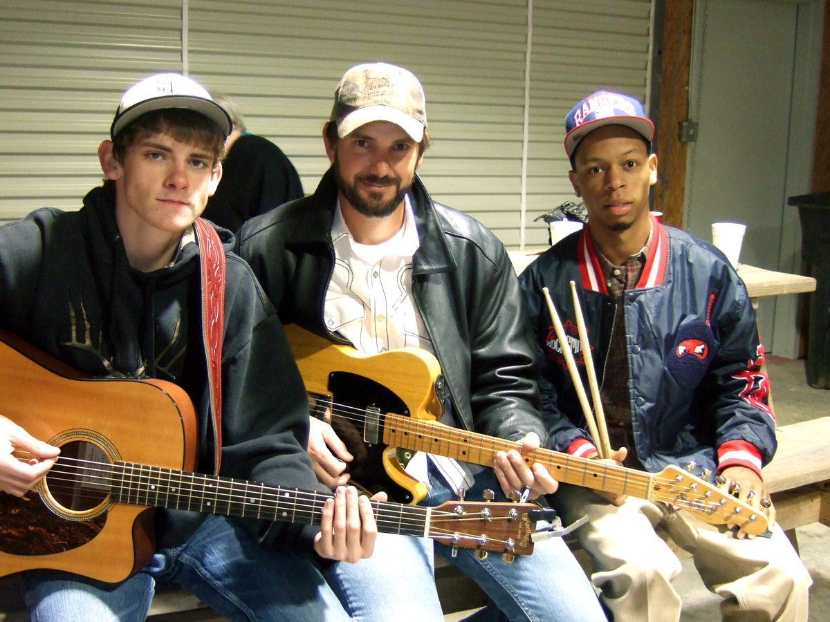Image: The Moonshine Band take a break for a photo op.