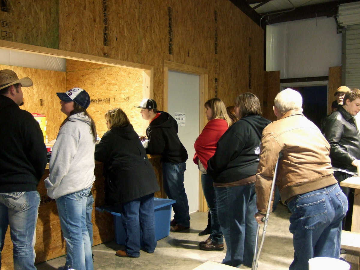 Image: They are lined up and waiting for a delicious BBQ dinner.