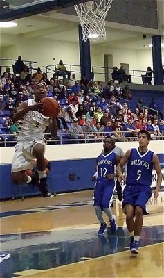 Image: Sophomore Trevon Robertson(1) finishes the fast break for Italy.