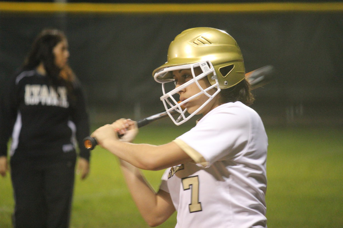 Image: Alma Suaste takes a few warm up swings.