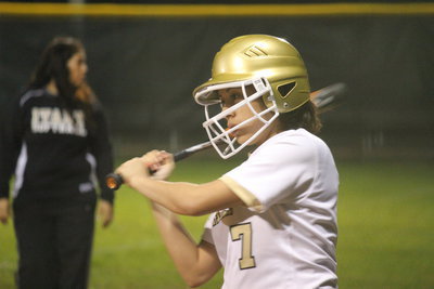 Image: Alma Suaste takes a few warm up swings.