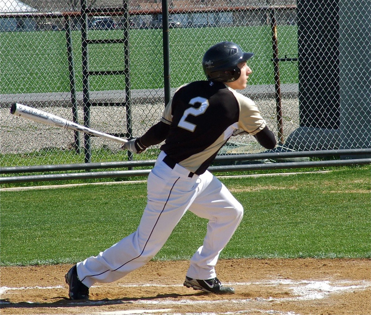 Image: Chace McGinnis(2) takes off after getting a hit for Italy.