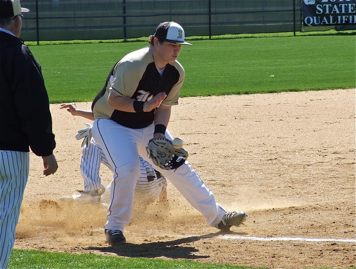 Image: John Byers(12) controls a throw from Escamilla behind the plate as the duo try repeatedly to collar a Bulldog at third base.