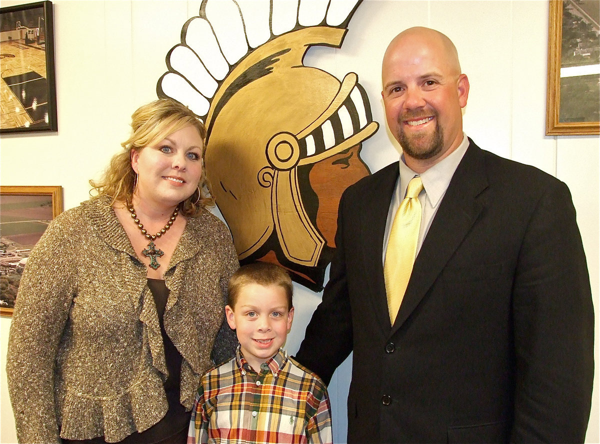Image: Coach Hank Hollywood, his wife Amy and their son Brock, a kindergardener. Their older son D.J., a 4th grader, refused to miss his baseball practice explained a smiling Coach Hollywood.