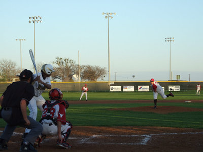 Image: Axtell sends the ball to Gladiator John Hughes.