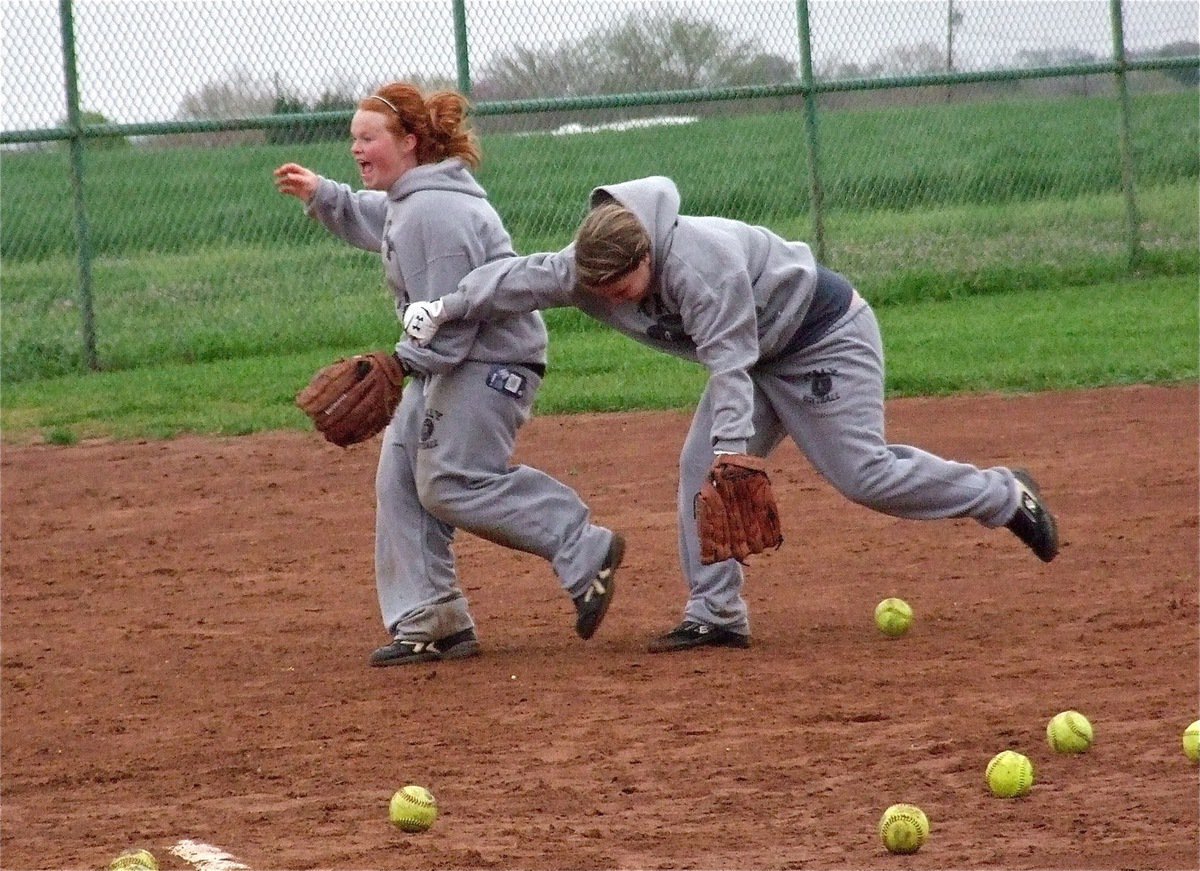 Image: Katie Byers and Paige Westbrook challenge one another for a grounder.