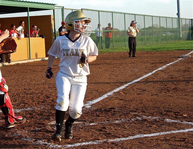 Image: Tara Wallis(8) hurries home for another Lady Gladiator run.
