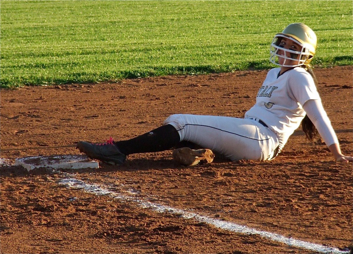 Image: Alyssa Richards beats the throw to third base.