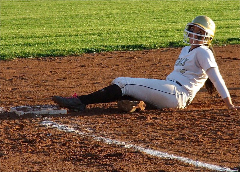 Image: Alyssa Richards beats the throw to third base.