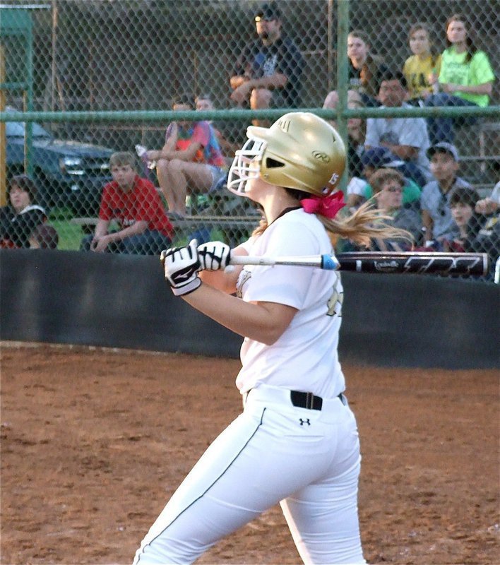 Image: Jaclynn Lewis(15) sends a ball into Axtell’s outfield.