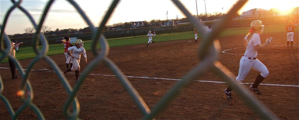 Image: With Jaclynn Lewis and Alyssa Richards leading the way, Coach Reeves sends her runners home.