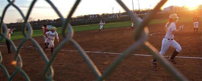 Image: With Jaclynn Lewis and Alyssa Richards leading the way, Coach Reeves sends her runners home.