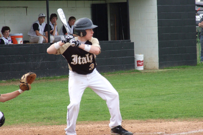 Image: Italy’s John Escamilla(3) steps into the swing against Grandview’s pitcher.