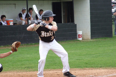 Image: Italy’s John Escamilla(3) steps into the swing against Grandview’s pitcher.