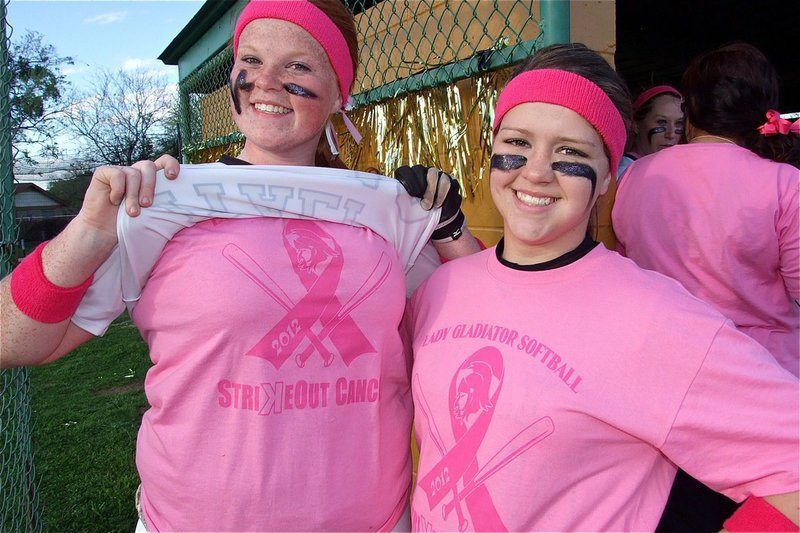 Image: Proud to be dawning pink shirts under their uniforms are junior Katie Byers and sophomore Paige Westbrook.