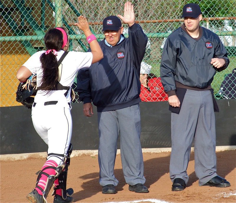 Image: Old friends. Lady Gladiator catcher Alyssa Richards high fives a familiar face.