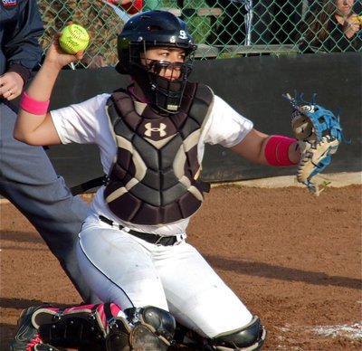 Image: Alyssa Richards gets to work behind the plate for Italy.