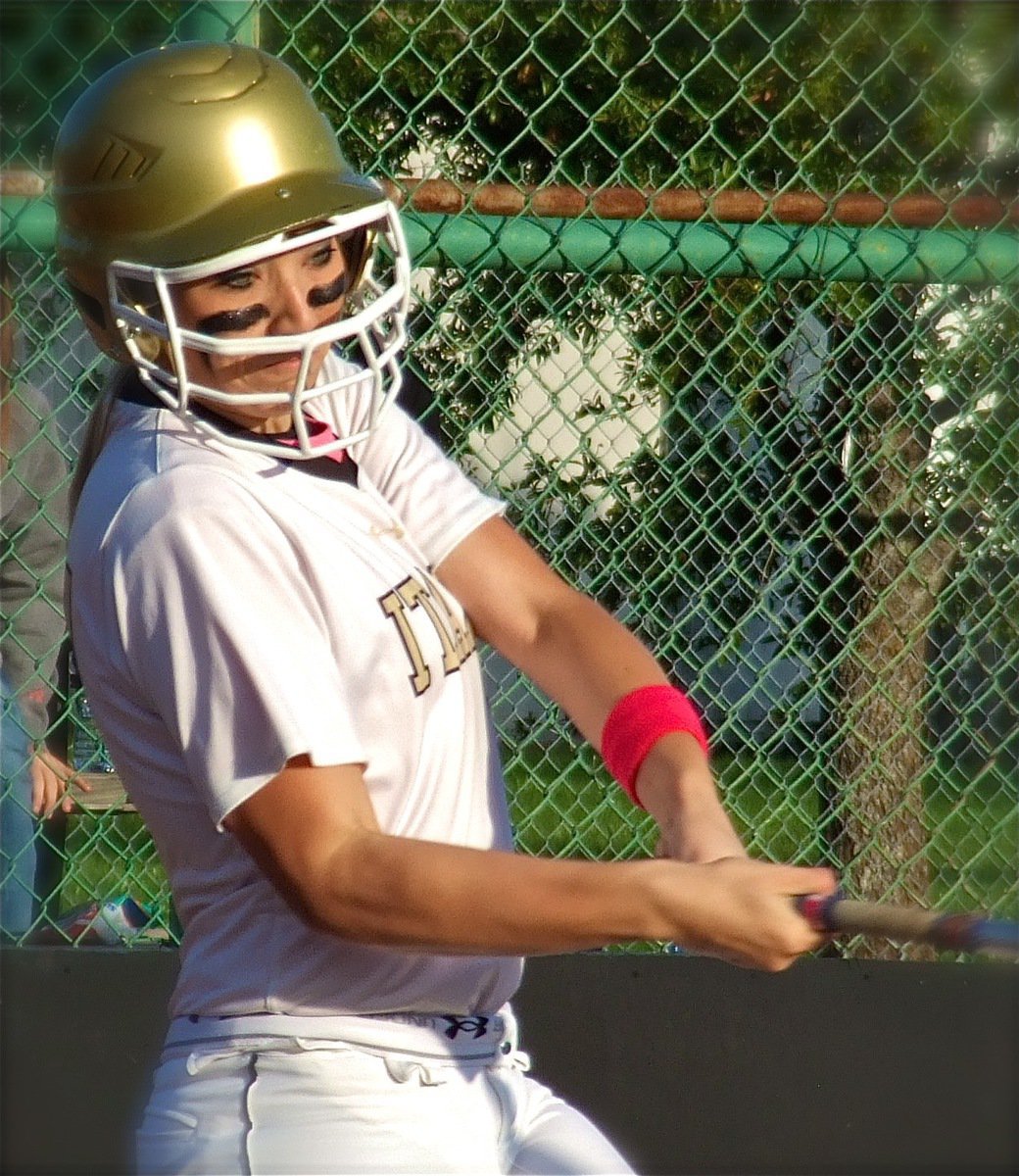 Image: Senior Lady Gladiator Megan Richards battles at the plate and fouls one off.