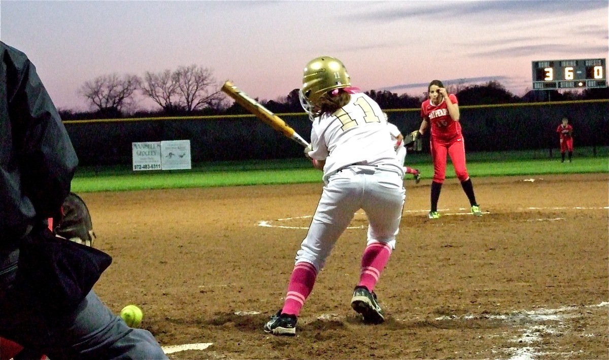 Image: Freshman Bailey Eubank(11) tries to slap her way onto first base.