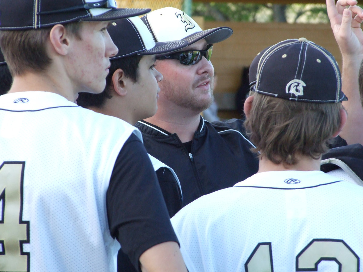 Image: Coach Josh Ward directs the players to different positions on the field.