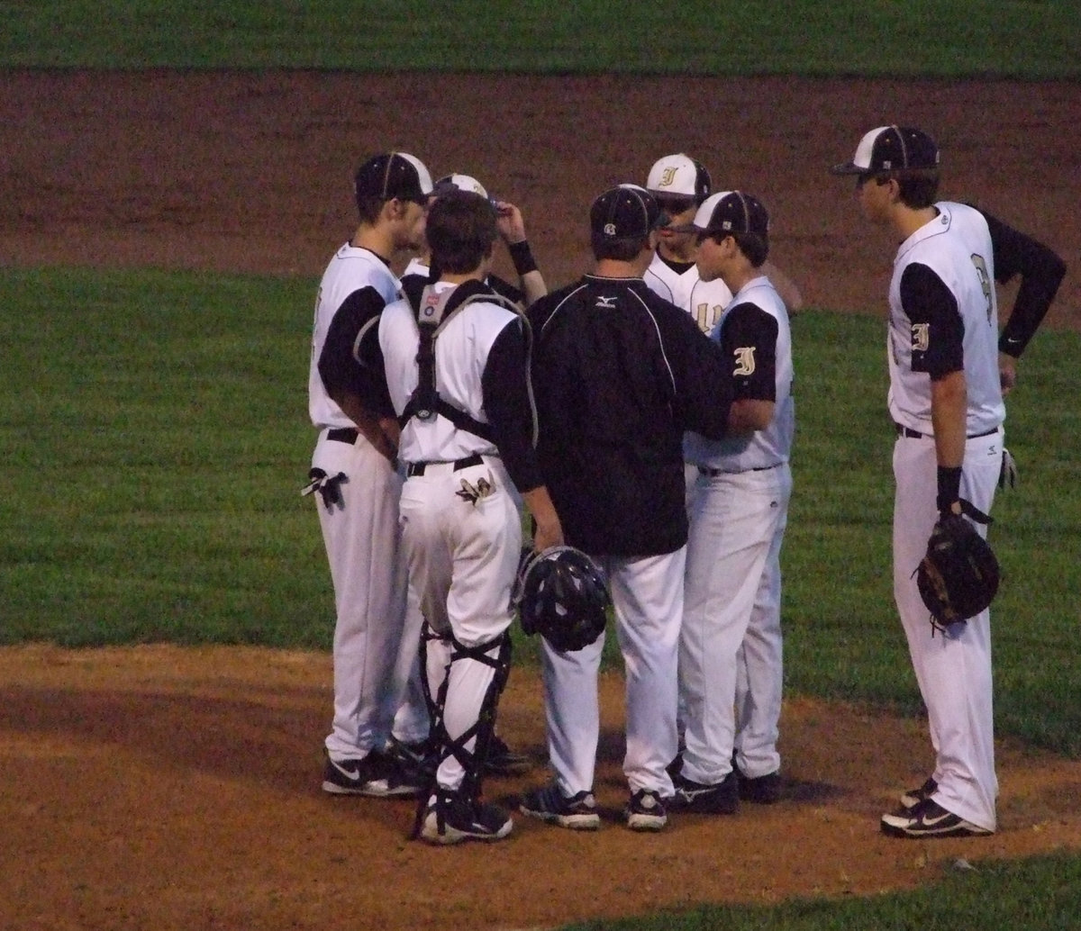 Image: The infield talk with Coach Ward.