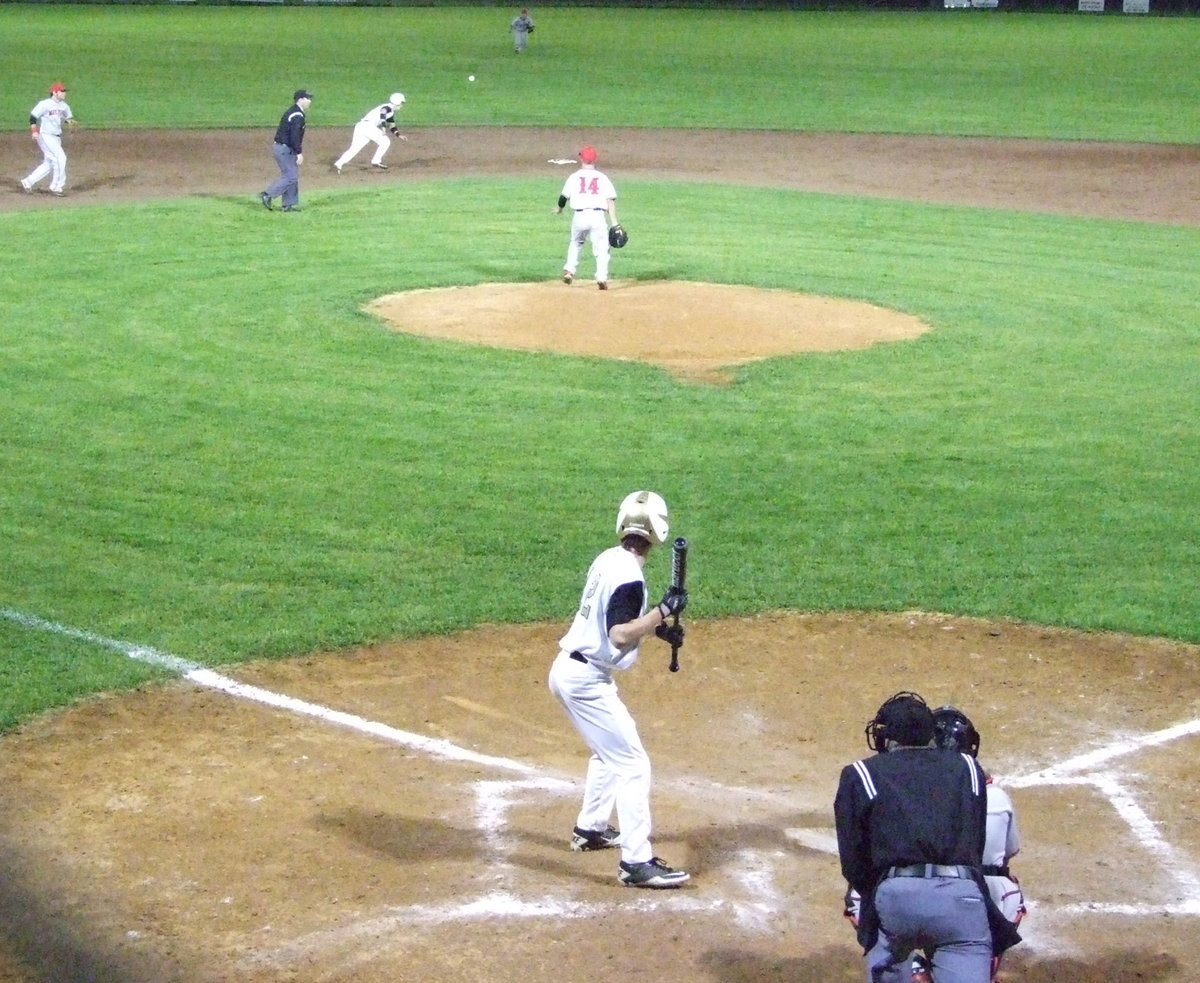 Image: Justin Wood waits for his turn at bat.