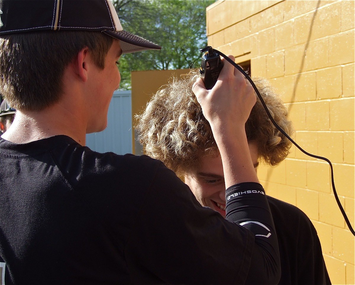Image: Slugger, Ross Stiles, takes first cut at demolishing the fluffy dew of teammate, Brandon Souder, as a fundraiser for the Italy Gladiator Baseball Team.