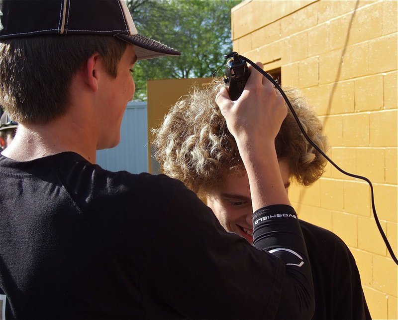 Image: Slugger, Ross Stiles, takes first cut at demolishing the fluffy dew of teammate, Brandon Souder, as a fundraiser for the Italy Gladiator Baseball Team.