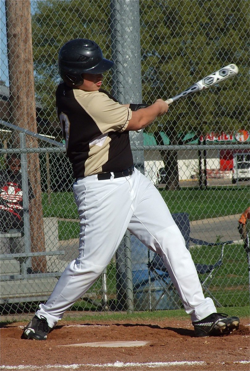 Image: Zain Byers singles down the first base line.