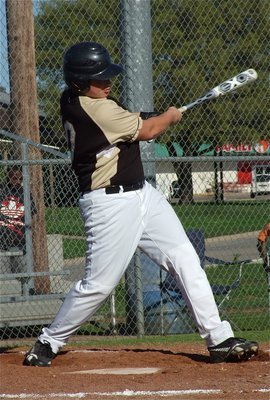 Image: Zain Byers singles down the first base line.