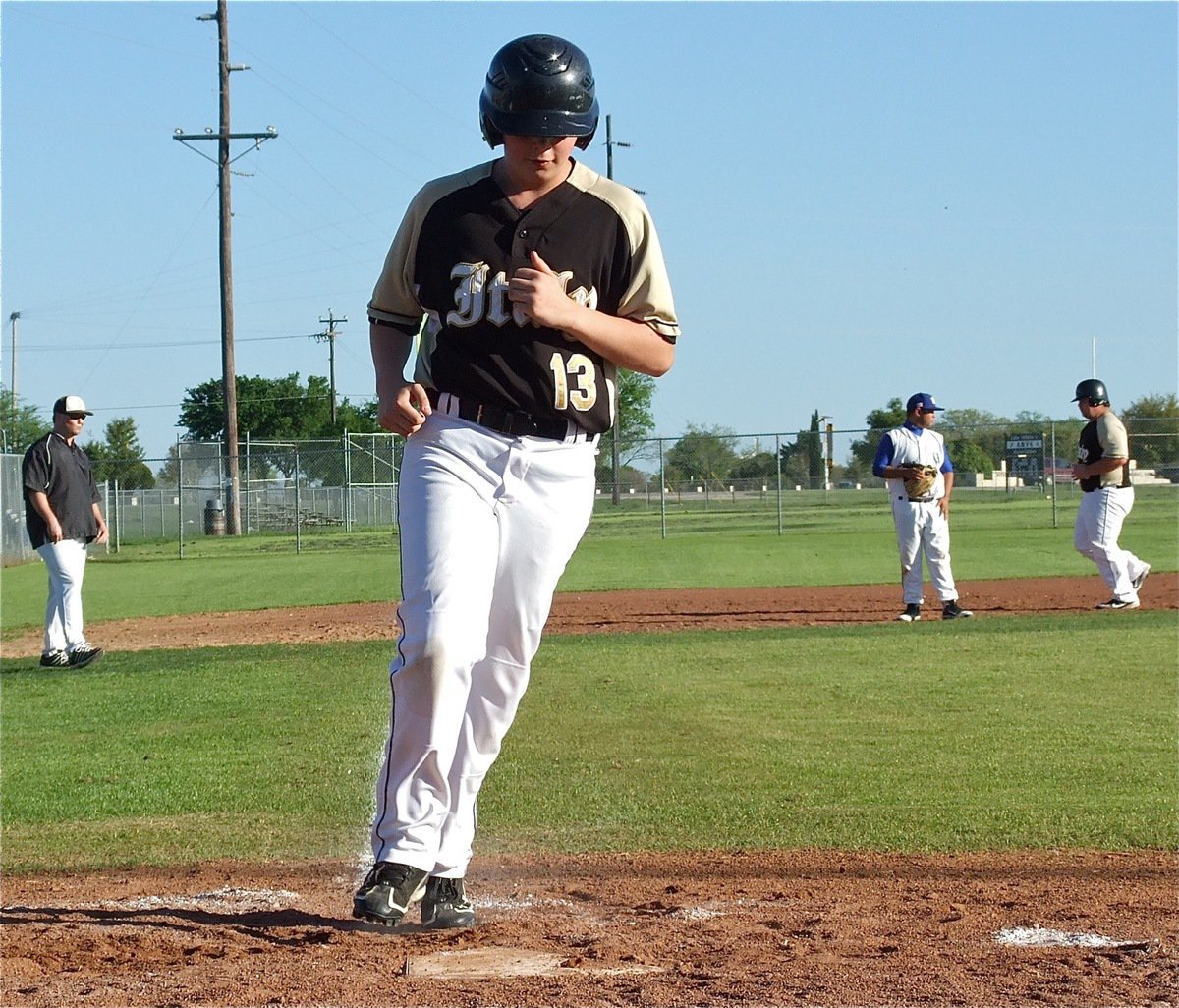 Image: Tyler Crawley scores for Italy off a bases loaded walk.