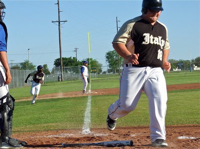 Image: Hank Seabolt rumbles across home plate followed by Marvin Cox.