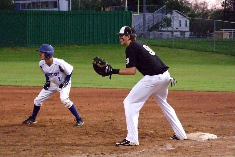 Image: Cole Hopkins(9) helps keep a Whitney base runner honest.