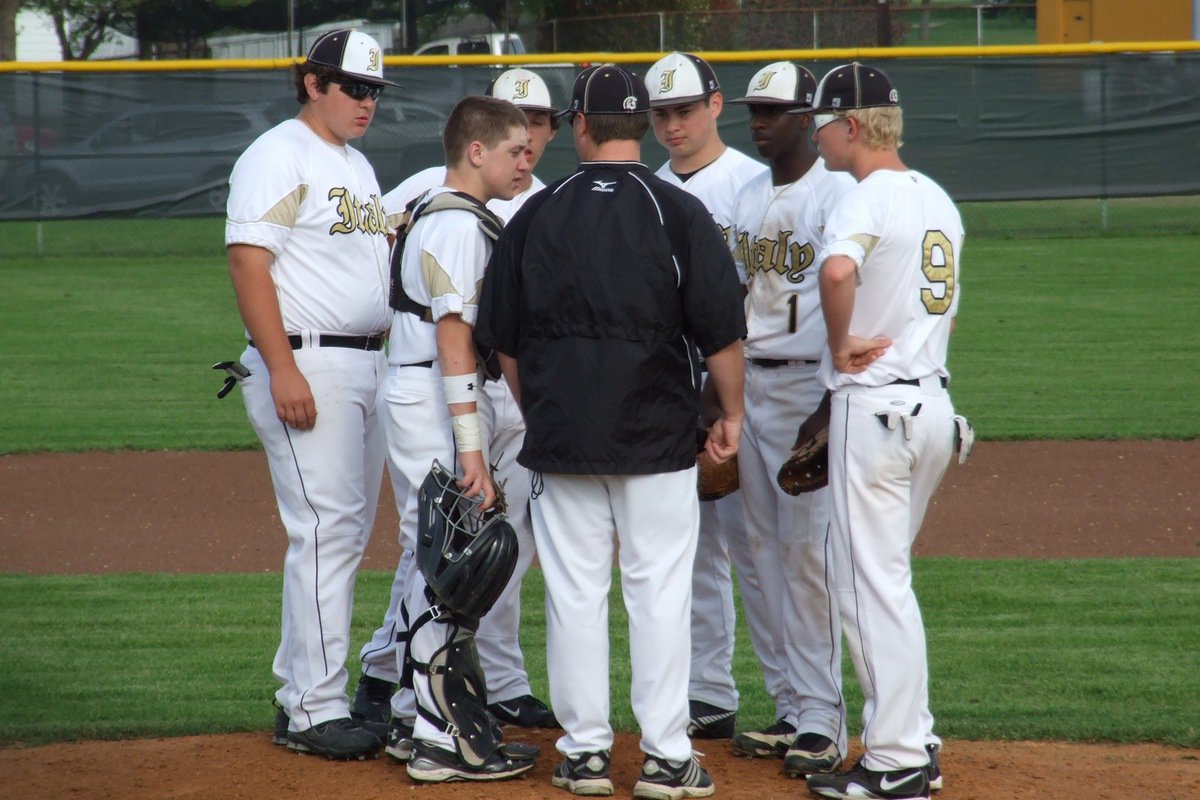 Image: Gladiator baseball head coach, Josh Ward, talks with his JV infielders, consisting of: Kevin Roldan, John Escamilla, Chace McGinnis, Zain Byers, Marvin Cox and Cody Boyd.