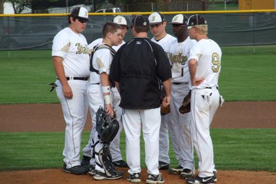 Image: Gladiator baseball head coach, Josh Ward, talks with his JV infielders, consisting of: Kevin Roldan, John Escamilla, Chace McGinnis, Zain Byers, Marvin Cox and Cody Boyd.