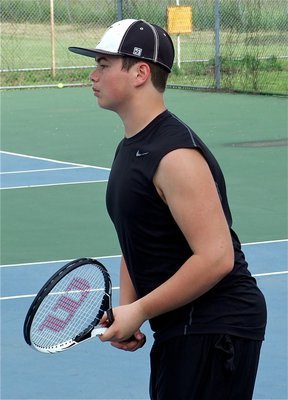 Image: With a steadfast stance, Zain Byers is ready for the upcoming serve.