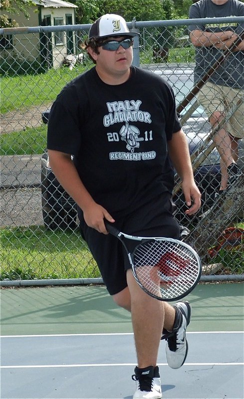 Image: On the move, Kevin Roldan relies on his Nike shoes to get this point.